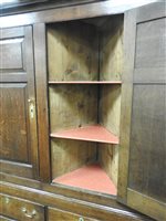 Lot 619 - A George III oak house keepers cupboard