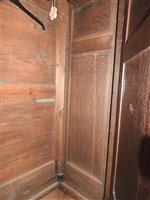 Lot 619 - A George III oak house keepers cupboard