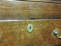 Lot 619 - A George III oak house keepers cupboard