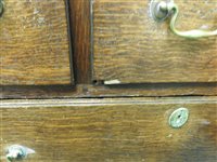 Lot 619 - A George III oak house keepers cupboard