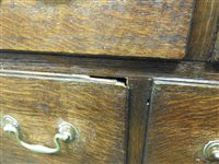 Lot 619 - A George III oak house keepers cupboard