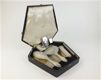 Lot 52 - A cased dressing table set