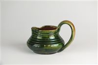 Lot 239 - A green glazed jug by Edwin Beer Fishley (1832-1911)