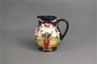 Lot 261 - A Moorcroft jug in the Royal Gold pattern