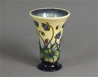 Lot 265 - A Moorcroft trumpet vase in the Hepatica pattern