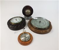 Lot 219 - Three aneroid barometers and a desk clock