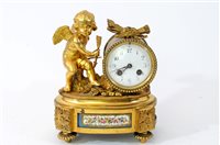 Lot 449 - A French gilt bronze and porcelain inset mantel clock by Henri Marc, Paris