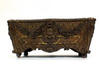 Lot 199 - A Continental carved walnut jardiniere