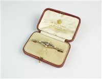 Lot 117 - A diamond and pearl bar brooch