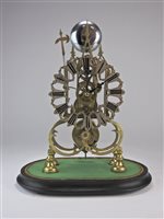 Lot 208 - A brass skeleton clock with triple steeple open frame and single fusee movement