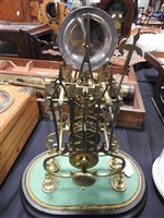 Lot 208 - A brass skeleton clock with triple steeple open frame and single fusee movement