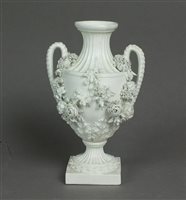 Lot 211 - A Derby parian relief moulded vase with twin handles