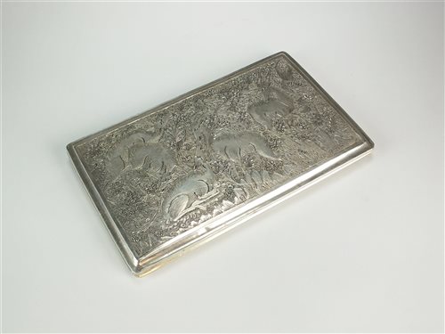 A white metal cigarette case