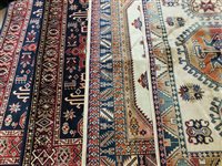 Lot 417 - An Artificial silk machine made rug of Kazak design