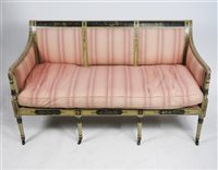 Lot 573 - An early 19th century cream and florally painted Neoclassical sofa