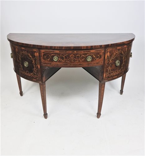 A mahogany and inlaid demi-lune sideboard