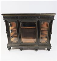 Lot 328 - French ebony and gilt and breakfront vitrine cabinet