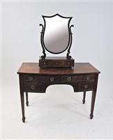 Lot 224 - An Edwardian mahogany bow front dressing table