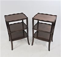 Lot 588 - A pair of mahogany three tier bedside tables