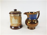 Lot 86 - A Royal Doulton tobacco jar and a selection of copper lustre jugs