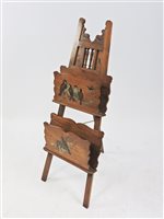 Lot 574 - An Edwardian walnut and painted magazine rack