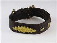 Lot 495 - A leather and brass dog collar, late 19th / early 20th century