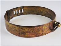 Lot 477 - A copper and brass dog collar, 19th century