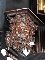 Lot 522 - A Black Forest quarter striking “cuckoo and quail” wall clock