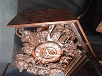Lot 522 - A Black Forest quarter striking “cuckoo and quail” wall clock