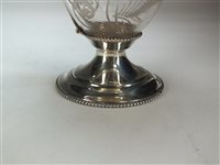 Lot 55 - A silver mounted claret jug