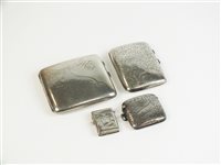 Lot 2 - Two silver cigarette cases and two vesta cases