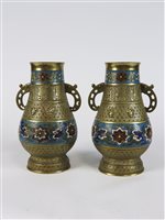 Lot 184 - A pair of Chinese champleve brass and champleve two handled vases