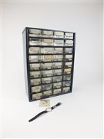 Lot 17 - A thirty-six drawer cabinet with watch crystals
