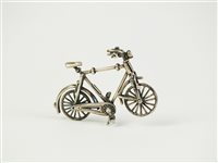 Lot 1 - A silver model of a bike