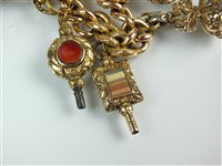 Lot 118 - A charm bracelet with attached fobs