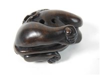 Lot 294 - A Japanese rosewood netsuke of a monkey