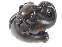 Lot 294 - A Japanese rosewood netsuke of a monkey