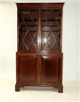 Lot 286 - A mahogany and box wood strung book case