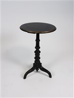 Lot 259 - A Victorian ebonised and gilded tripod table
