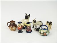 Lot 111 - Two Beswick cats, tubelined ceramics, a stoneware jug and other items