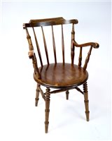 Lot 266 - An early 20th century walnut office armchair