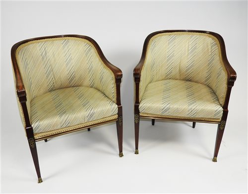 Lot 147 - A pair of late French Empire mahogany framed brass-strung bergere tub chairs