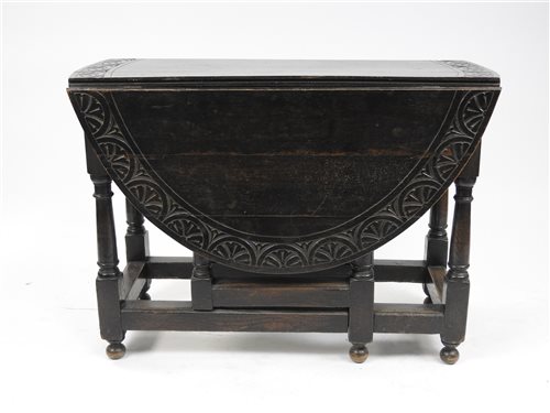 Lot 240 - A Victorian stained oak gateleg table