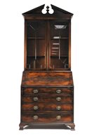 Lot 225 - A reproduction George III style mahogany bureau bookcase