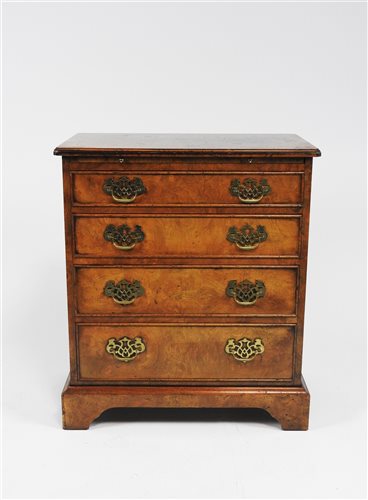 Lot 245 - A reproduction figured walnut bachelor's chest