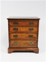 Lot 245 - A reproduction figured walnut bachelor's chest