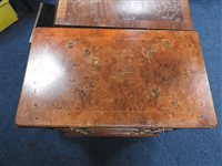 Lot 245 - A reproduction figured walnut bachelor's chest