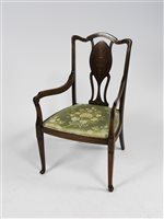 Lot 292 - An Edwardian mahogany and inlaid parlour arm chair
