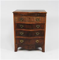 Lot 284 - A reproduction crossbanded mahogany bachelor's chest in George III style