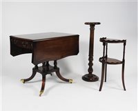 Lot 223 - A reproduction mahogany finished sofa table in Regency style